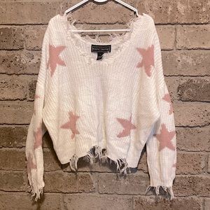 Trendy ripped hem star sweater